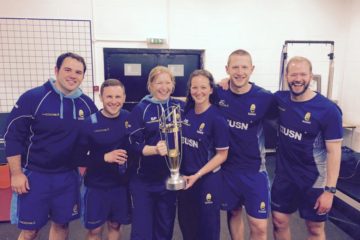 John Chaffe holding championship trophy with the medical team at Worcester Warriors